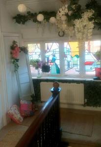 a staircase with a window with flowers on it at Jesmond B&B Kingsize Ensuite Room 2 in Hull