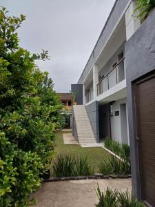 an external view of a building with stairs and plants at 16 on Ryde in Durban