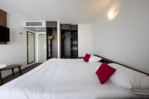 Ένα ή περισσότερα κρεβάτια σε δωμάτιο στο Campanile Limoges Centre - Gare