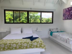 Casa de las Flores tropical客房内的一张或多张床位