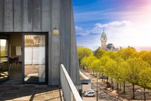 a building with a clock tower in the distance at Campanile Limoges Centre - Gare in Limoges +134 photos
