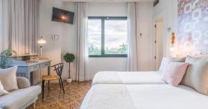 Posteľ alebo postele v izbe v ubytovaní Hotel Catalina