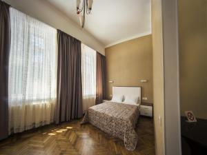 Кровать или кровати в номере Apart Hotel Kvartira 1