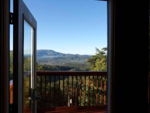 a balcony with a view of a mountain view at Yogi's Den: Breathtaking Views! 3 min to Dollywood, on 1 acre! in Sevierville