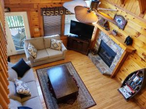 an overhead view of a living room with a fireplace at Yogi's Den: Breathtaking Views! 3 min to Dollywood, on 1 acre! in Sevierville