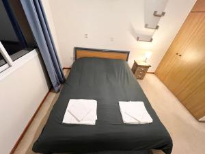 Postel nebo postele na pokoji v ubytování 212 Apartment, A 2-bedroom escape