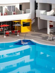 a view of a swimming pool in a building at Sholeo Lodges Los Gigantes in Puerto de Santiago