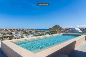 a swimming pool with a view of a city at Condo near Marina - Downtown - Pool - King in Cabo San Lucas