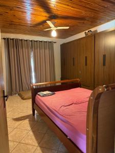 A bed or beds in a room at Casa de campo Itirapina/SP