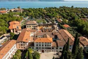 an aerial view of a town with buildings at Hotel Antico Monastero in Toscolano Maderno