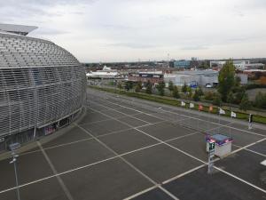 an aerial view of a parking lot with a building at Twenty Business Flats Lille Grand Stade in Villeneuve d'Ascq