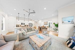 a living room with a couch and a table at New 30A Inlet Beach House - Sleeps 14 - 10 beds in Rosemary Beach