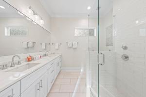 a white bathroom with two sinks and a shower at New 30A Inlet Beach House - Sleeps 14 - 10 beds in Rosemary Beach +32 photos