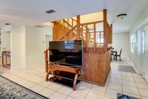 a home office with a desk and a wooden wall at Lake Days and Golf Outings Summerfield Group Escape in Summerfield