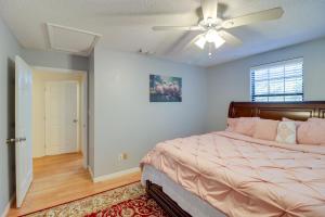 a bedroom with a bed and a ceiling fan at Lake Days and Golf Outings Summerfield Group Escape in Summerfield +24 photos