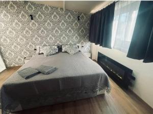 Postel nebo postele na pokoji v ubytování Suites GREY in centro Randazzo