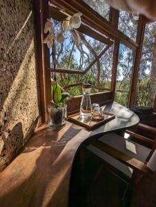 a table in a room with a window at Magical Treehouse in Lagos
