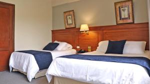 Postel nebo postele na pokoji v ubytování Hotel Florida