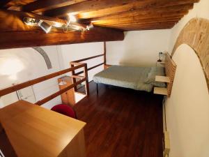 Letto o letti in una camera di Loft Rustico