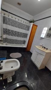 a bathroom with an american flag on the wall at El Fortin in Mar del Plata