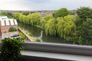 a view of a river from a window at Bootle, Liverpool Trendy 1Bed Ft in Liverpool