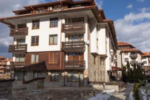an apartment building in the middle of a city at Cedar Lodge III 2 BDRM Flat B12 in Bansko