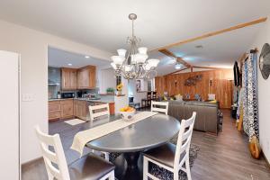 a kitchen and dining room with a table and chairs at Roswell Radiance in Roswell