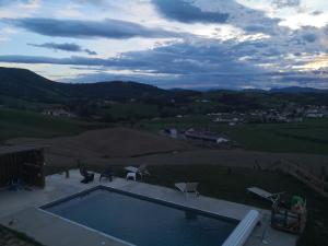 a swimming pool on the roof of a house at Gites Mendiburia in Iholdy