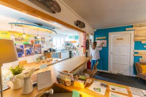 a young boy is standing in a room at SURF HOSTEL BIARRITZ in Biarritz