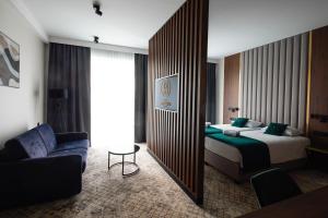 Postel nebo postele na pokoji v ubytování Restoria Hotel***