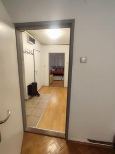 a view of a hallway from a room with a mirror at Cassa de Familia in Sarajevo