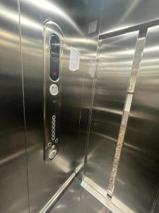 a metal elevator with a remote control on it at دار المسك in Dammam