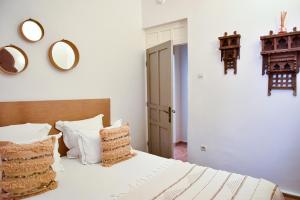 Postel nebo postele na pokoji v ubytování Riad Lyon-Mogador