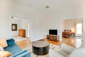 a living room with a couch and a tv at Pet-Friendly Montrose Home, Walk to Town! in Montrose