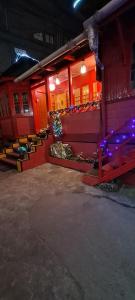 a building with a christmas tree in the front of it at Bloom inn in Shillong