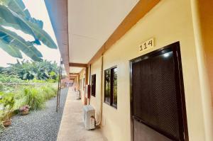 un edificio con una porta con il numero sopra di M & M's Home stay at Palawan Casa a Città di Puerto Princesa