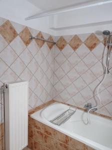 a bathroom with a white sink and a tub at Trikala Alex House in Tríkala +14 photos