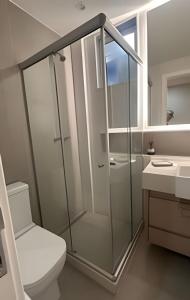 a bathroom with a shower and a toilet and a sink at Apto Luxuoso, 50 Mts da Praia em Copacabana para 6 in Rio de Janeiro