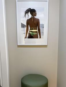 a picture of a woman in a bikini on a wall at Apto Luxuoso, 50 Mts da Praia em Copacabana para 6 in Rio de Janeiro