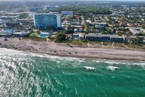 an aerial view of a beach and the ocean at Garden Beach studio @The Island in Deerfield Beach