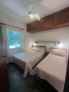 Ένα ή περισσότερα κρεβάτια σε δωμάτιο στο Casa Portador Paraty