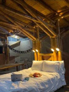 Tempat tidur dalam kamar di Oasis Santuario de Naturaleza
