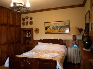 a bedroom with a bed with two towels on it at Traditional County House close to Trikala 