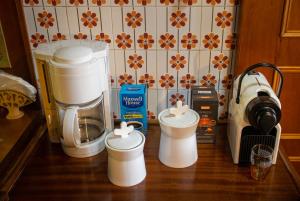 a kitchen counter with a mixer and a coffee maker at Mouria County House in Tríkala +29 photos