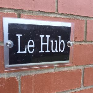 a sign on a brick wall with the words ice hub at City Hideaway in Leeds in Leeds +21 photos