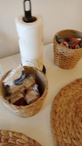 a basket of food sitting next to a roll of paper towels at Piazzetta Degli Innamorati in Bari