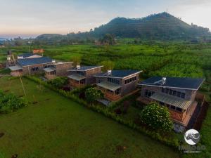 an aerial view of a house in a field at Imbogo Diners and Lounge in Kisoro