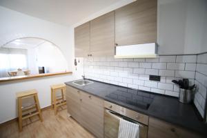 a kitchen with a sink and a counter top at Casa de playa, cerca de todo in Los Narejos