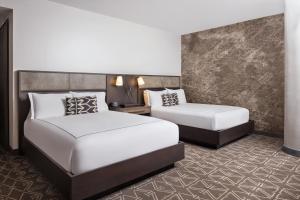 Postel nebo postele na pokoji v ubytování Hotel Van Zandt