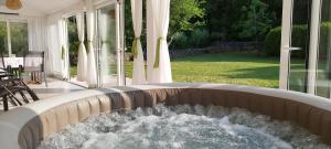 a water fountain in the middle of a patio at Holiday House Vela Vrta in Sveti Ivan Dobrinjski